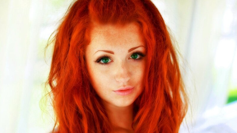 woman with red hair and green eyes