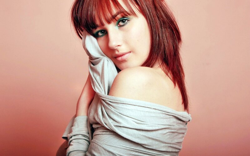 woman with red hair and green eyes