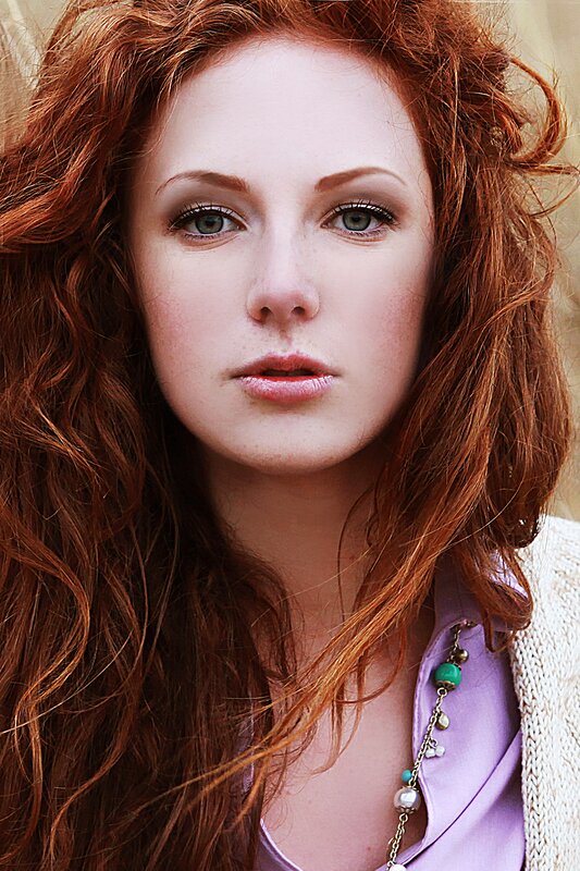 woman with red hair and green eyes