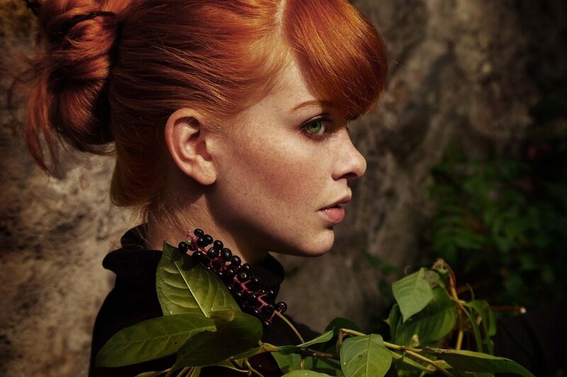 woman with red hair and green eyes