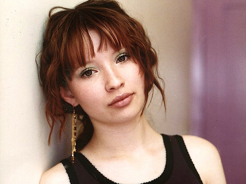 woman with red hair and green eyes