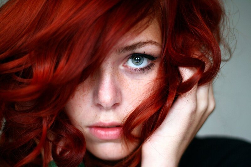 woman with red hair and green eyes