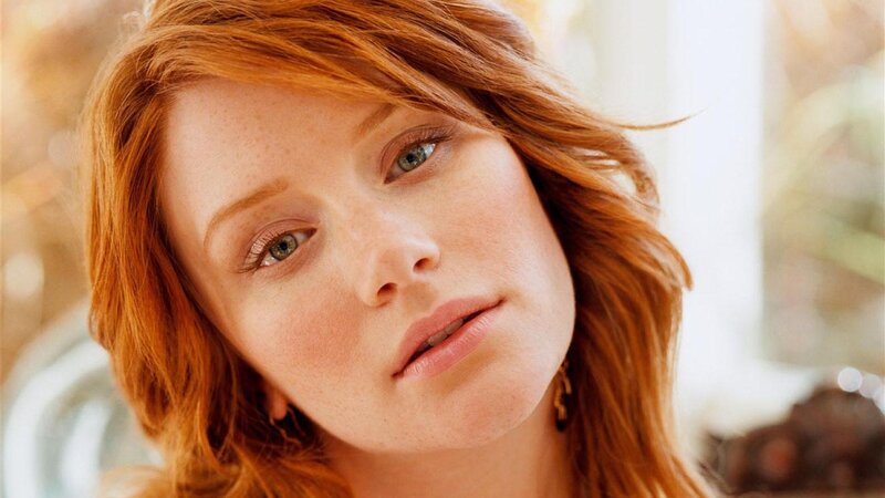 woman with red hair and green eyes