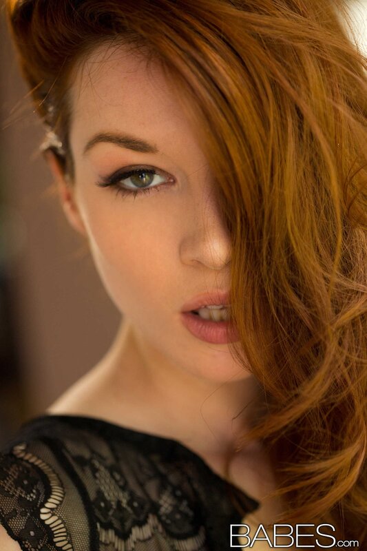 woman with red hair and green eyes