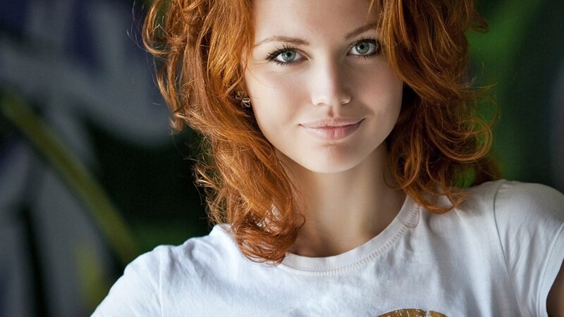 woman with red hair and green eyes