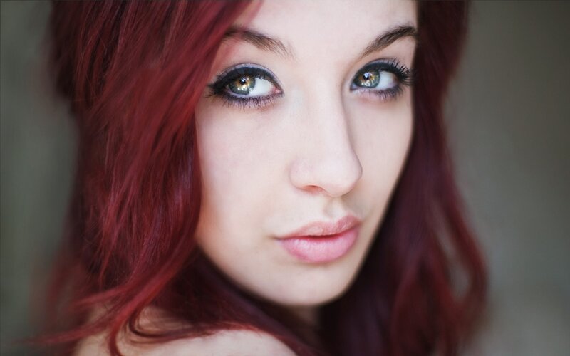 woman with red hair and green eyes