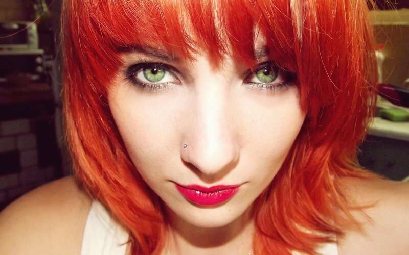 woman with red hair and green eyes