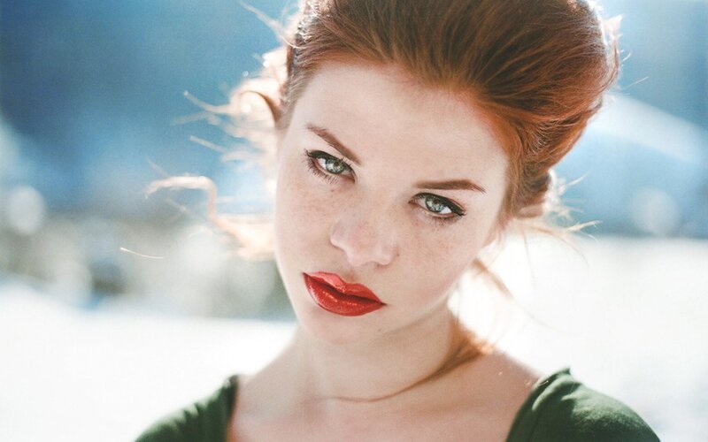 woman with red hair and green eyes