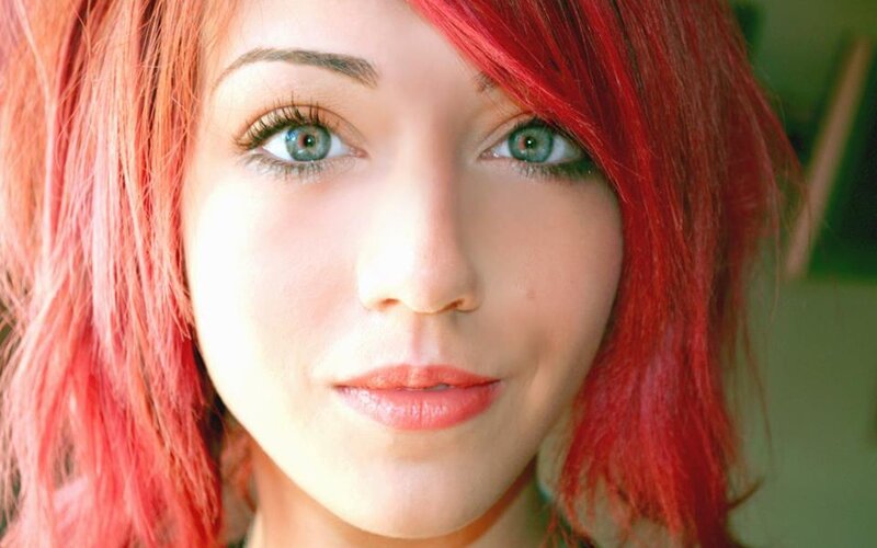 woman with red hair and green eyes