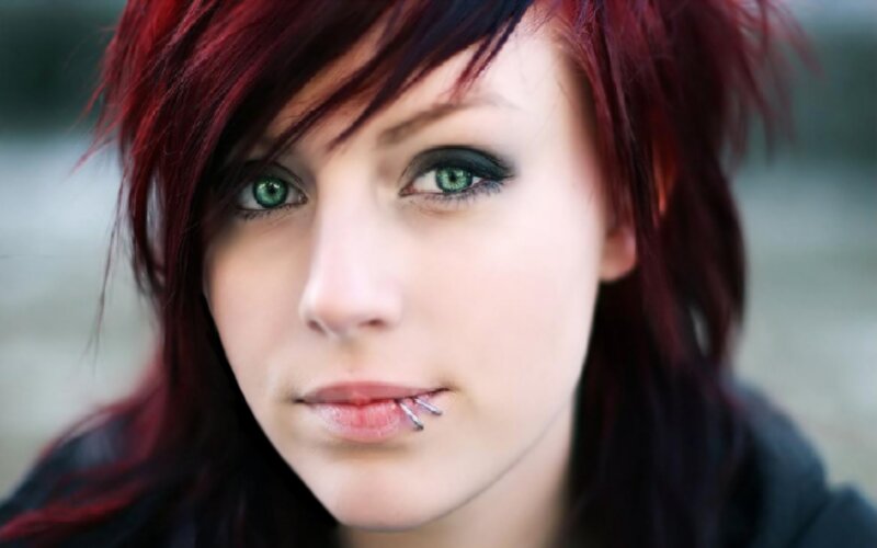 woman with red hair and green eyes