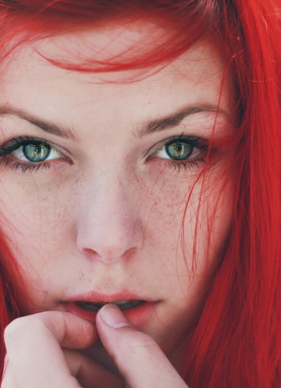 woman with red hair and green eyes