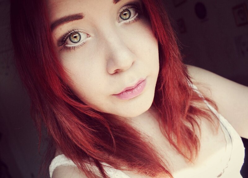 woman with red hair and green eyes