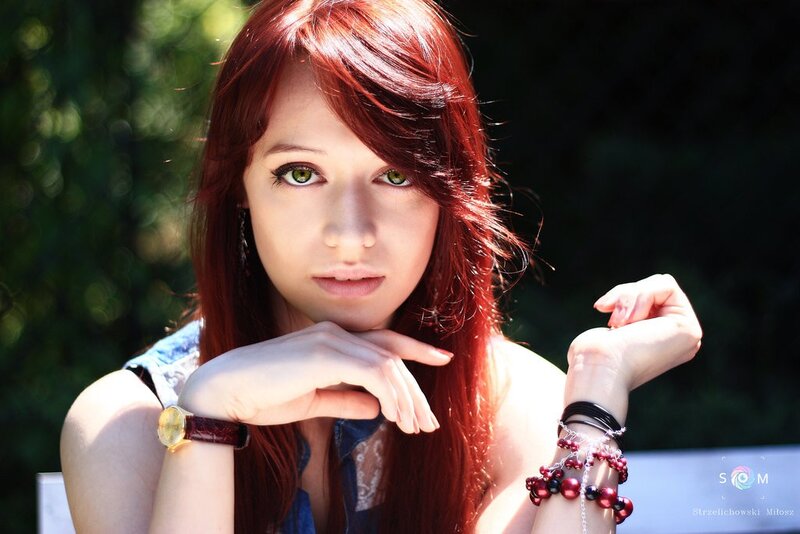 woman with red hair and green eyes