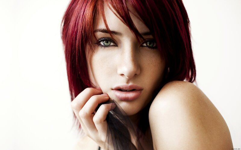 woman with red hair and green eyes