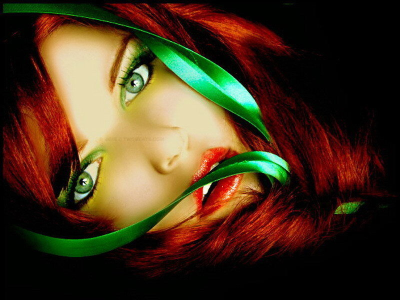 woman with red hair and green ribbon