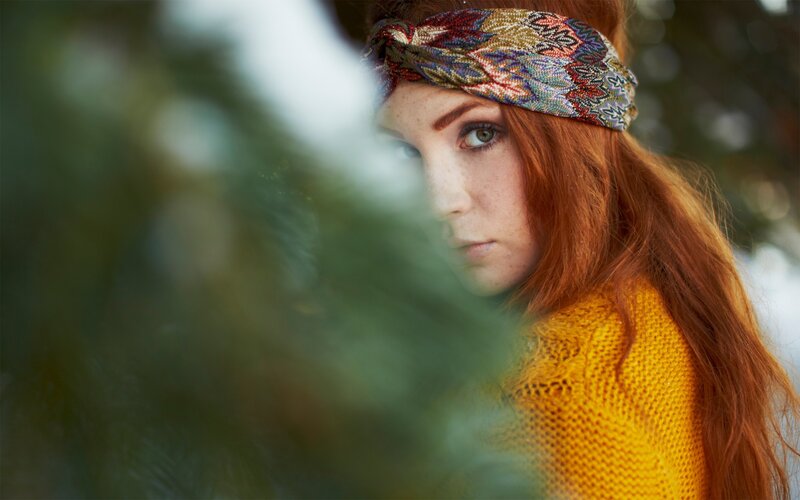 woman with red hair and headband