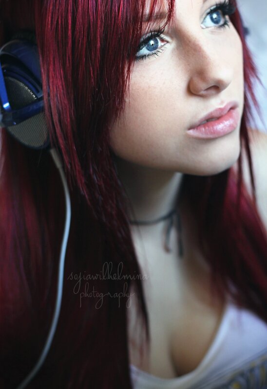 woman with red hair and headphones