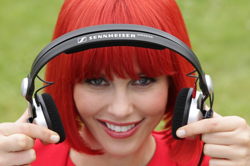 woman with red hair and headphones
