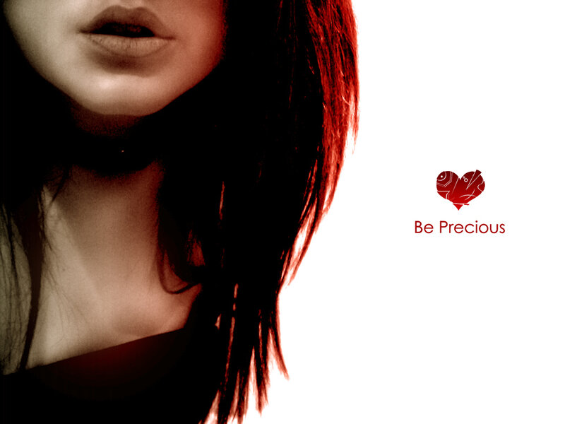 woman with red hair and heart logo