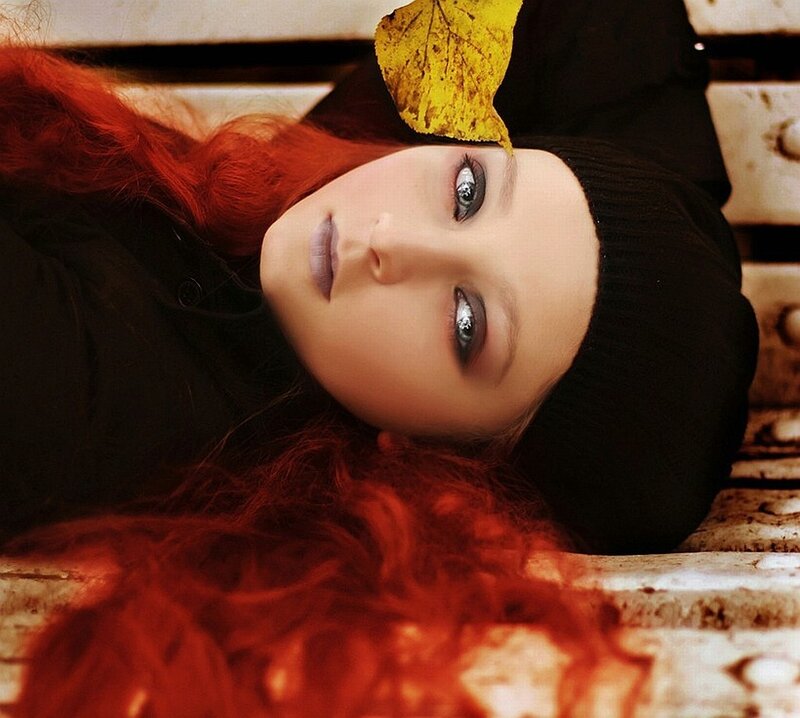 woman with red hair and leaf