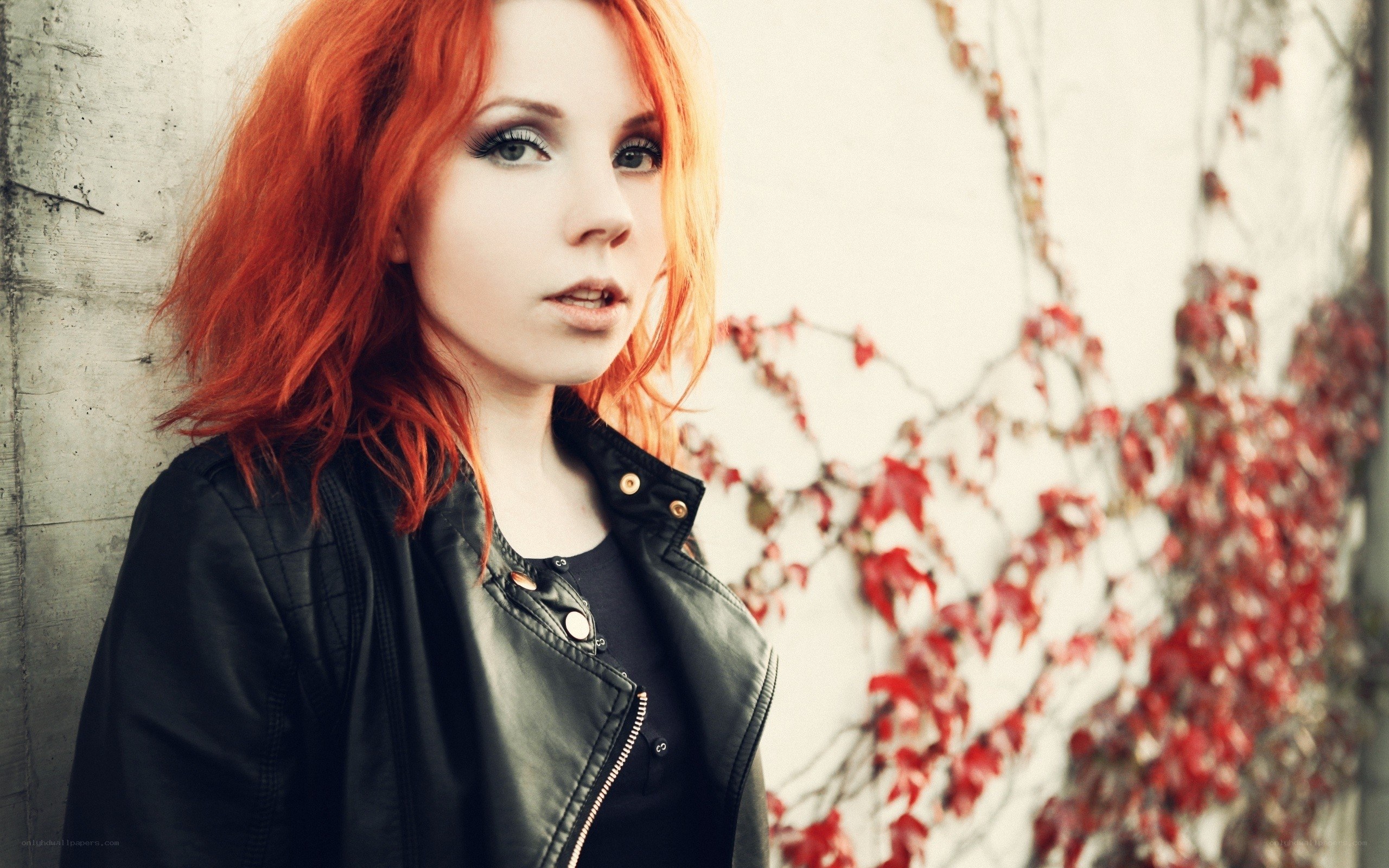 woman with red hair and leather jacket