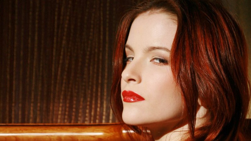 woman with red hair and lipstick