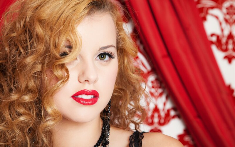 woman with red hair and lipstick