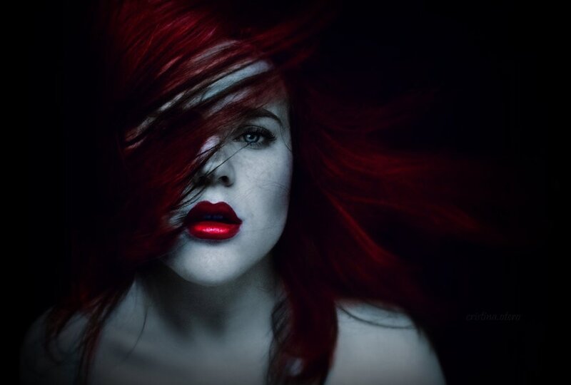 woman with red hair and lipstick