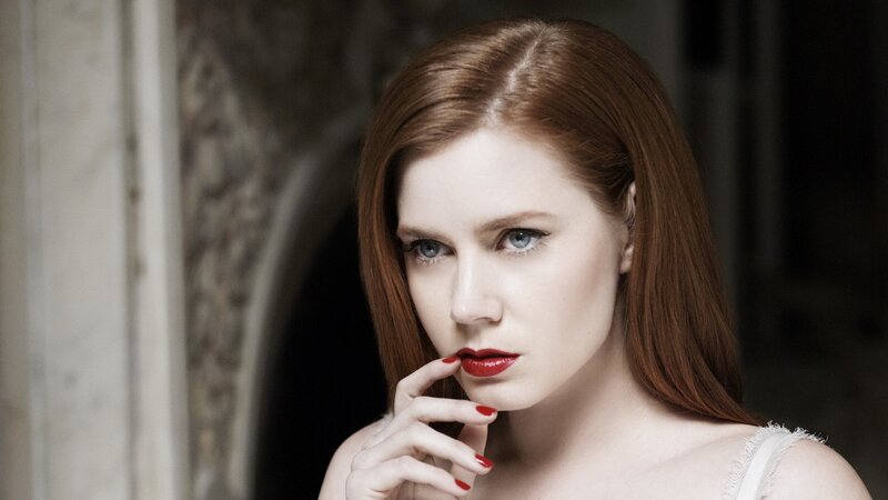 woman with red hair and lipstick