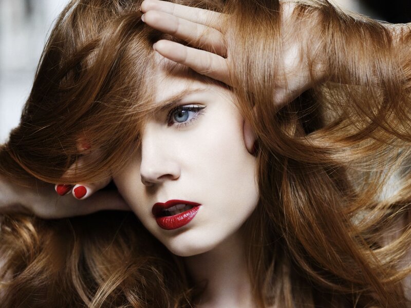 woman with red hair and lipstick