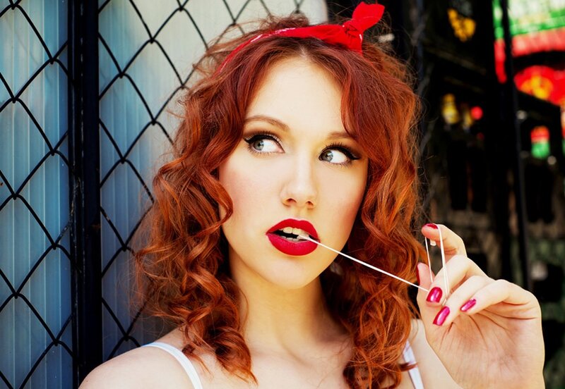 Woman with red hair and lipstick