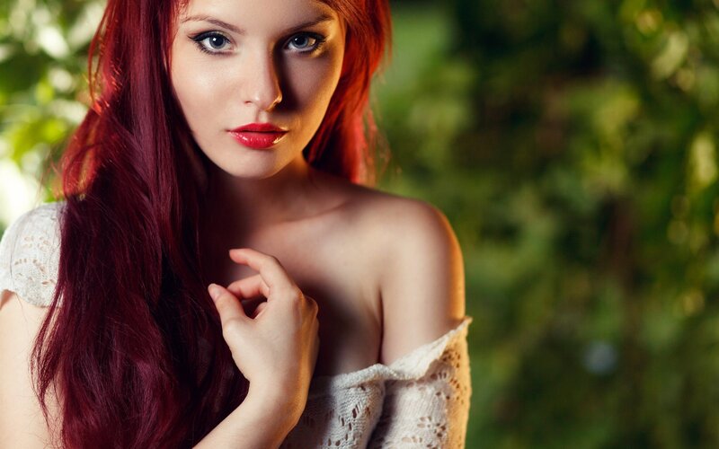 woman with red hair and lipstick