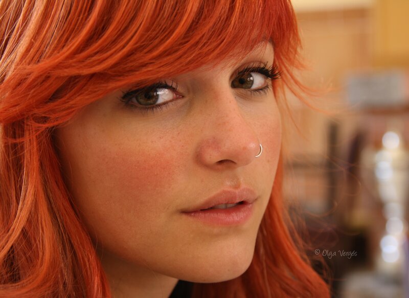 woman with red hair and nose ring