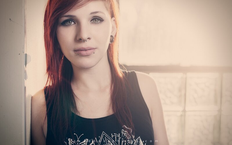 woman with red hair and piercings