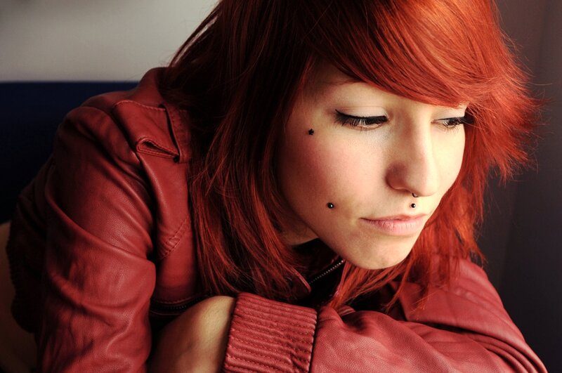 woman with red hair and piercings