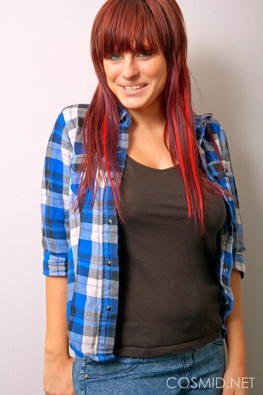 woman with red hair and plaid shirt