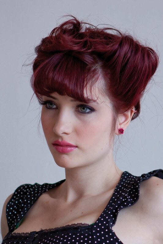 woman with red hair and polka dot top