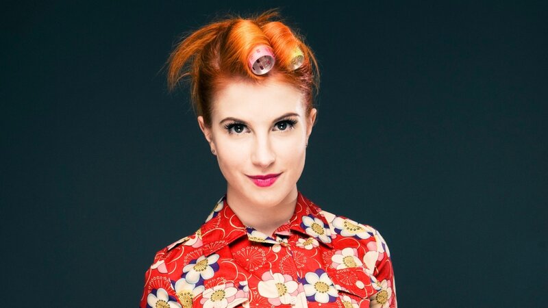 woman with red hair and rollers