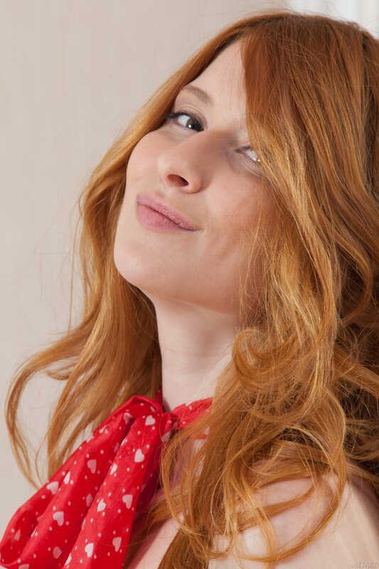 woman with red hair and scarf