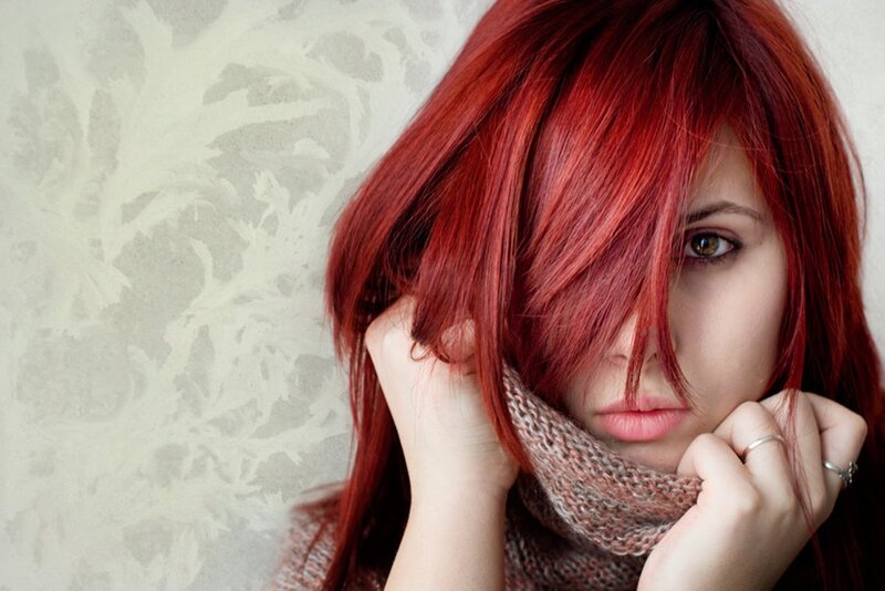 woman with red hair and scarf