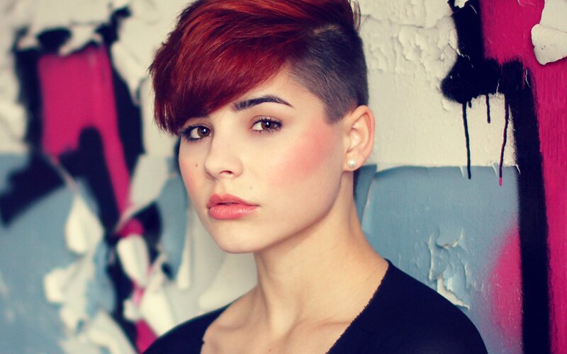woman with red hair and short haircut