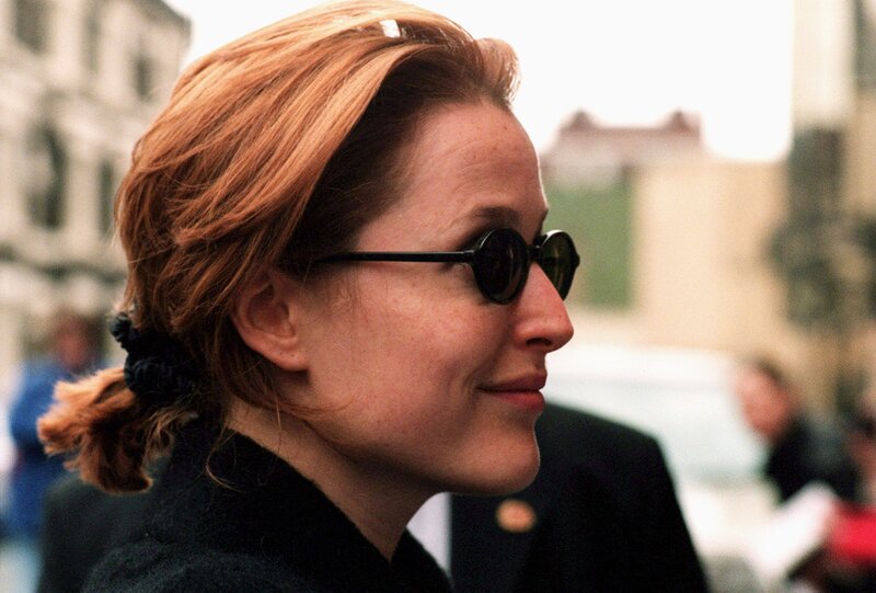 woman with red hair and sunglasses