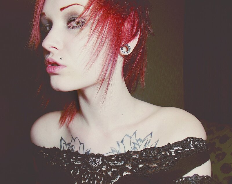 woman with red hair and tattoos