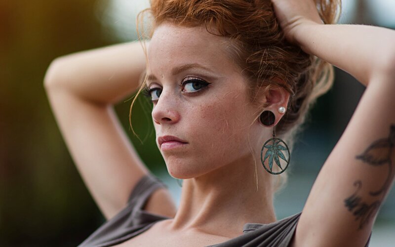 woman with red hair and tattoos