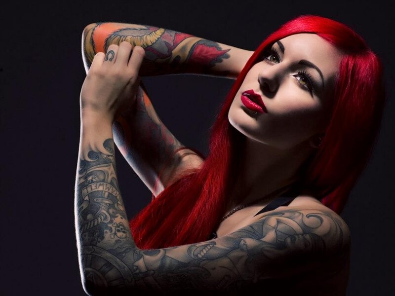 woman with red hair and tattoos