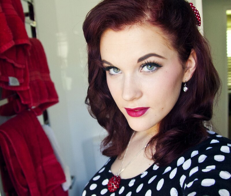 woman with red hair and vintage makeup