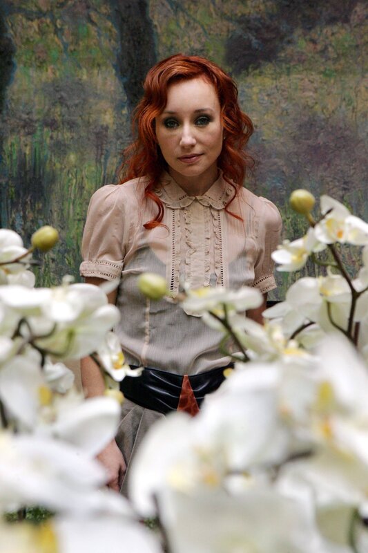 Woman with red hair and white flowers