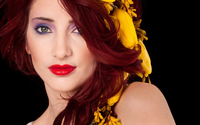woman with red hair and yellow flowers