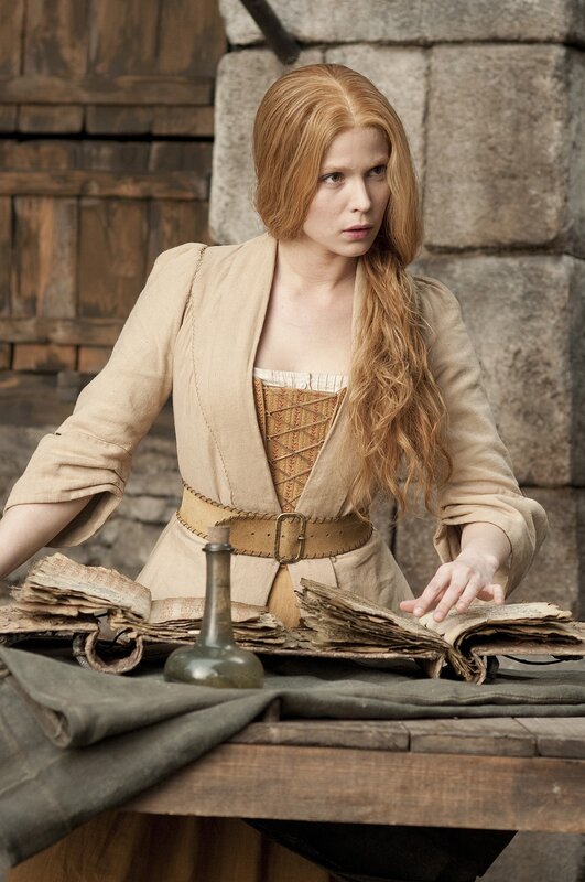 woman with red hair at a table
