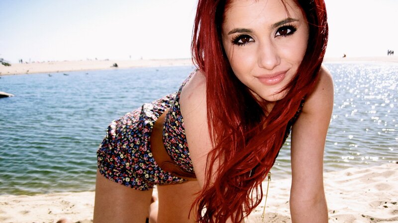 woman with red hair at beach